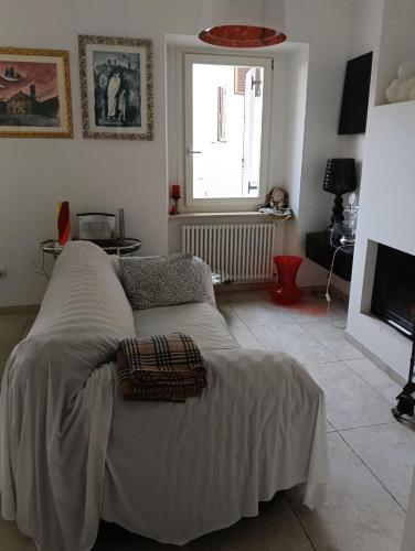 a bedroom with a bed with a blanket on it at Dimora Victoria in Ascoli Piceno