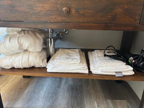 a shelf with white towels sitting on it at B&b la bessolina in Ivrea