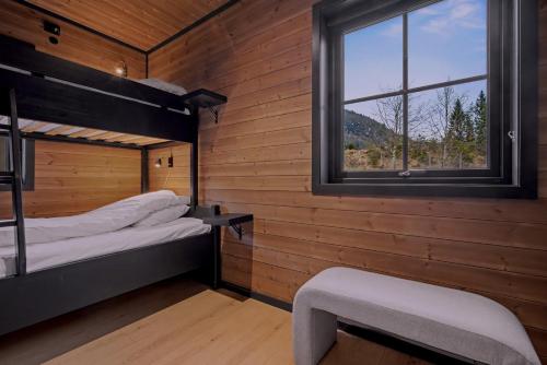 a room with two bunk beds and a window at Stryn Mountain Lodge in Stryn
