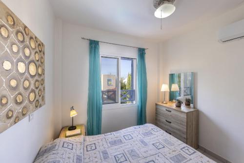 a bedroom with a bed and a window at Villa Irina Polis in Polis Chrysochous