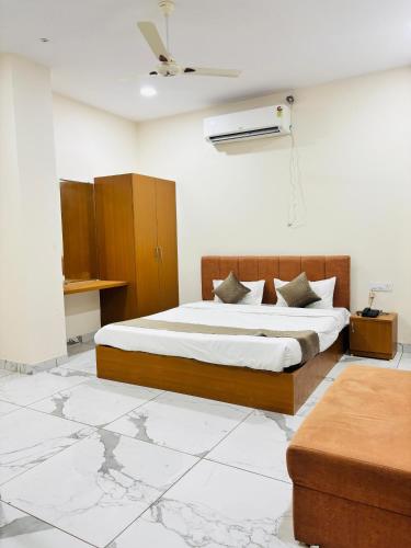 a bedroom with a bed in a room with at Hotel Venus Stays Near Prestige College Bhopal in Bhopal
