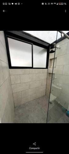 a view of a bathroom with two windows in a room at Glamping La Maestranza con desayuno incluido in Villamaría