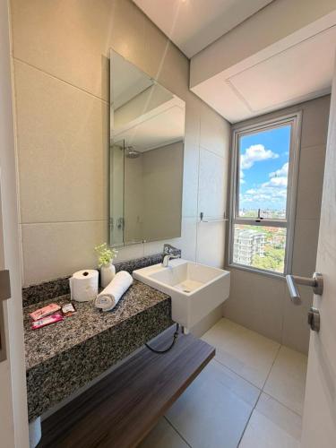 a bathroom with a sink and a mirror at Molas 112B in Asunción