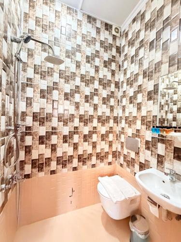 a bathroom with a toilet and a sink at April Mansion in Istanbul