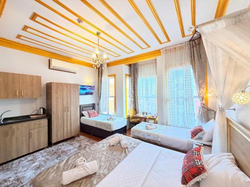 a large room with two beds and a kitchen at April Mansion in Istanbul