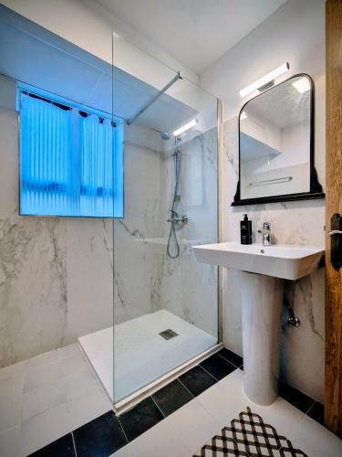 a bathroom with a sink and a shower at Escape to Paradise in St. Paul's Bay