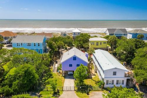 an aerial view of houses and the beach at Sandy Paws Retreat - 30 Day Rental in Folly Beach