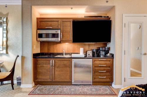 a kitchen with a sink and a microwave at MGM Signature-22-615 Strip View Balcony Studio in Las Vegas
