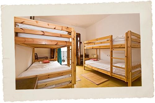 two bunk beds are in a room with at Pensión Bellavista in Port de Pollensa