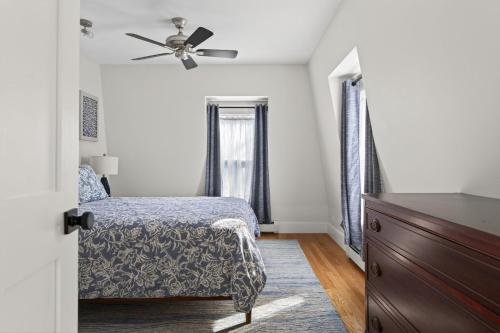a bedroom with a bed and a ceiling fan at Modern West End Townhome 3BR 2BA in Portland