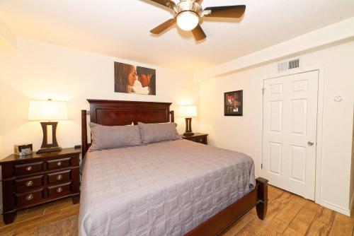 a bedroom with a bed and a ceiling fan at Captain Jacks Pearl in Port Aransas