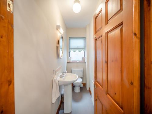 a bathroom with a white sink and a toilet at 3 Bed in Dingle oc-ii05995 in Dingle