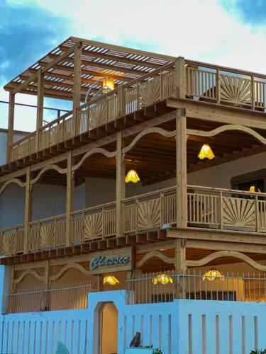a building with a deck on top of it at Classic Home DaHaB in Dahab