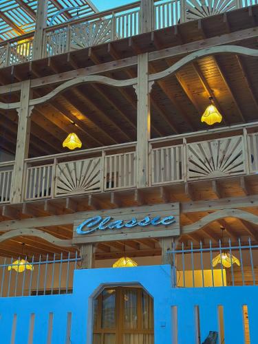 a building with a sign on the side of it at Classic Home DaHaB in Dahab