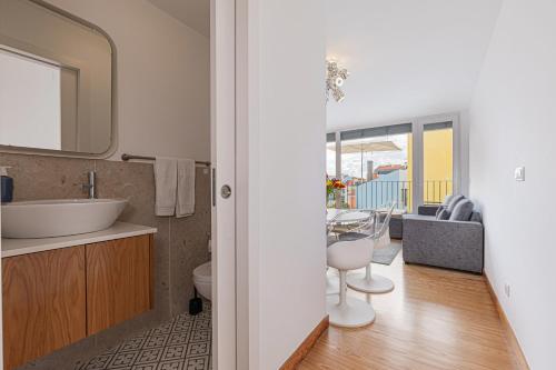 a bathroom with a sink and a mirror at Barbadinhos Apartments in Lisbon Historic Neighborhood in Lisbon