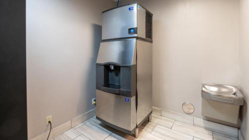 a water dispenser in the corner of a room at Holiday Inn Express Hotel & Suites Anderson by IHG in Anderson