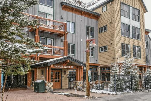 a large apartment building with a sign that reads ice bear at Black Bear 8035 by SummitCove Lodging in Keystone
