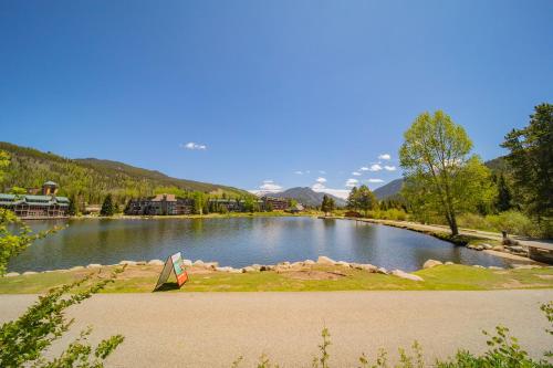 a lake with a kite in the middle of it at Argentine 1511 by SummitCove Lodging in Colorado in Keystone