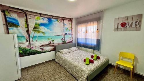 a small bedroom with a bed and a window at Villa Lloret De Mar in Lloret de Mar