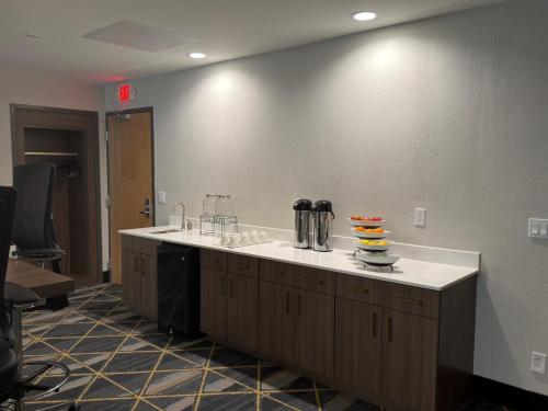 a bathroom with a sink and a counter top at Holiday Inn Midland by IHG in Midland