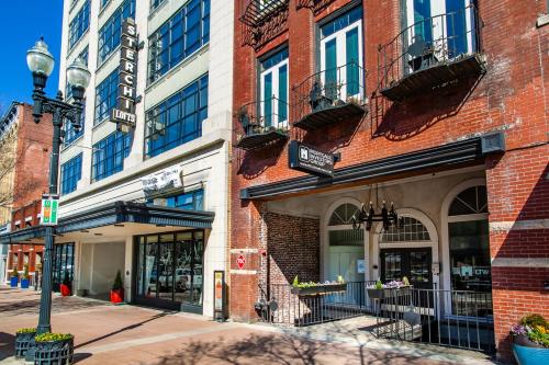 a brick building on a street in a city at Modern Downtown Loft - 1 mile to UT in Knoxville