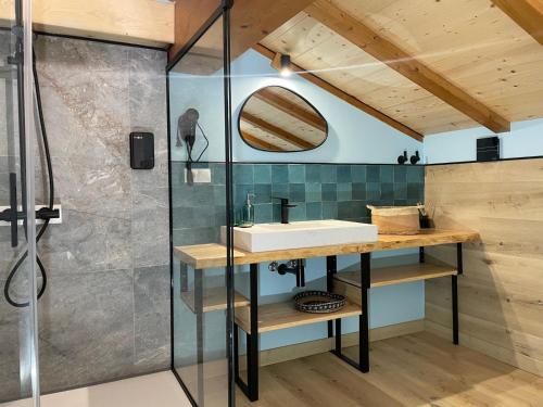 a bathroom with a sink and a shower at Gautegiz Arteaga Reserva Urdaibai in Isla Becoa