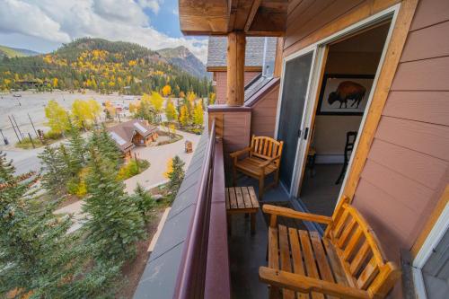 a balcony with two benches on a house at Buffalo Lodge 8411 by SummitCove Lodging in Colorado in Keystone