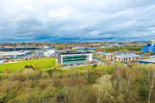 an aerial view of a city with a building at Hilltop Serviced Apartments-Stockport in Stockport
