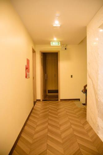 an empty hallway with a door in a building at Mia Hotel Cửa Lò in Vinh