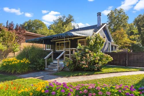 a house with flowers in front of it at Kayaks & River Access Easy Parking Beautiful in Gladwyne