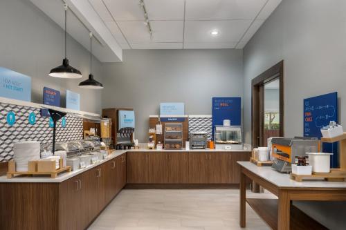 a store with a counter with many products on display at Holiday Inn Express & Suites Miami Kendall by IHG in Kendall
