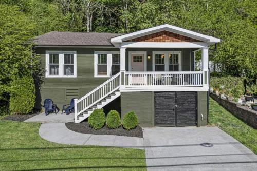 a small green house with a porch and a deck at Charming House 5 Minutes to Downtown Chattanooga and Aquarium in Chattanooga
