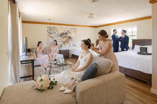 a bride and groom sitting on a couch in a room at Panorama Paradiso by CasadeLuz, 5Acre 360 Retreat close to Old Town Temecula Wine Country in Temecula