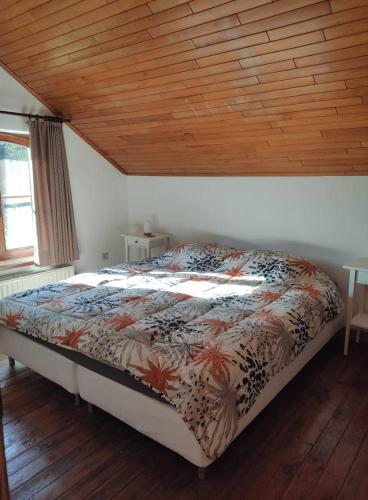 Llit o llits en una habitació de Ferme Moulin Henrot