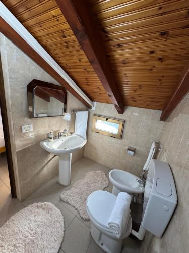a bathroom with a toilet and a sink at Blessed guest house in Shkodër