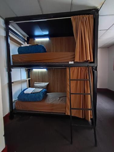 a group of bunk beds in a room at Eva hostel & chill Ayacucho in Ayacucho