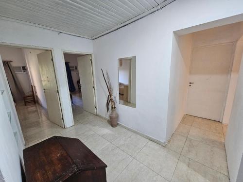an empty room with a table in the middle at El Ñangapiri in Mercedes
