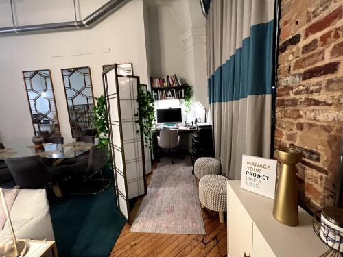 an office with a desk and a computer in a room at Stylish Loft, Walk to WORLD CUP! in Atlanta