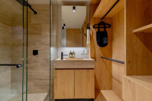 a bathroom with a shower and a sink at Lulu Condesa by Capitalia in Mexico City
