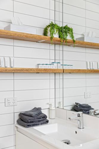 a bathroom with a sink and a mirror at Pet Room at Moody's in Blairgowrie