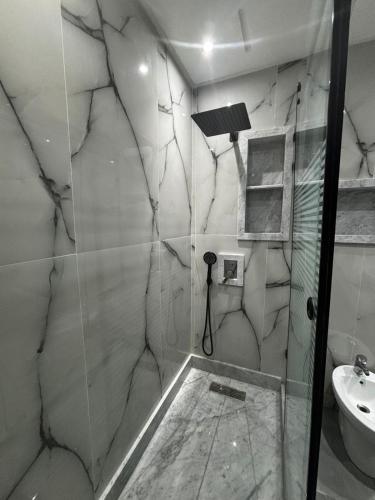 a bathroom with a shower and a sink at Apartment with sea view in Mohammedia