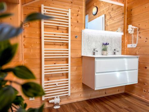 a bathroom with a sink and a mirror at Rattendorf 15A in Rattendorf