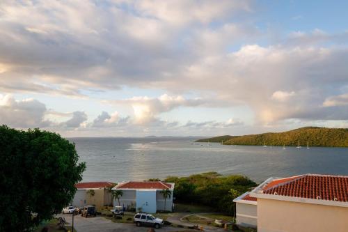 a view of a large body of water with buildings at Villa Costera 904 | Island Escapade | Culebra in Culebra