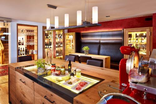a bar with a table with food on it at Hotel Tirol Fiss 4Sterne Superior in Fiss