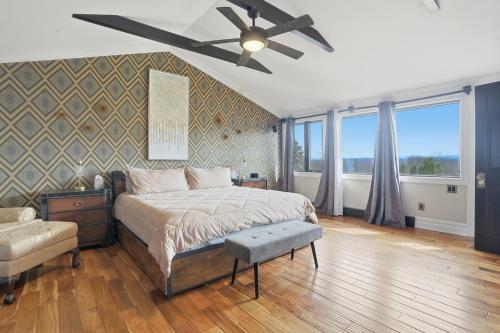 a bedroom with a bed and a ceiling fan at Summit Sanctuary with EV Ready Mountain Views in Poughkeepsie