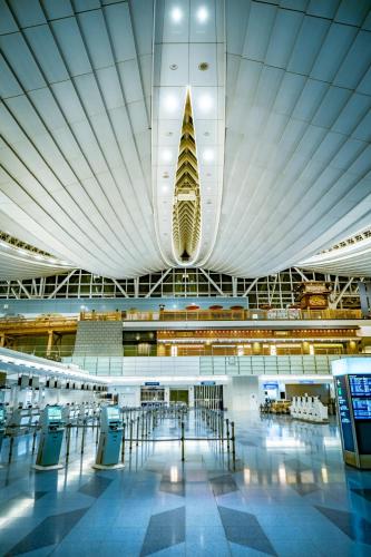 a large building with a boat hanging from the ceiling at trias 102 in Tokyo