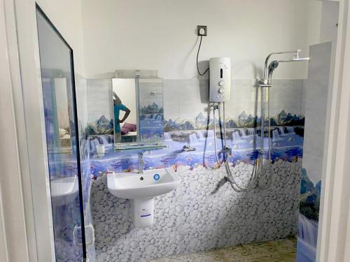a bathroom with a sink and a shower in it at Haritha Villa Yala in Kirinda