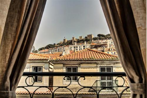 a large window with a view of a city at We Love F Tourists in Lisbon