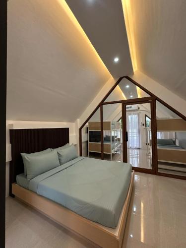 a bedroom with a large bed in a room at Casa Marcos Resort and Villas in Pastrana