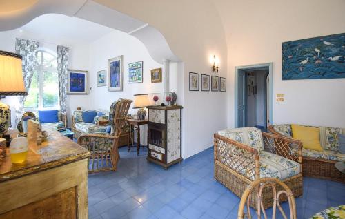 a living room with chairs and a table at Villa Marina in Anacapri